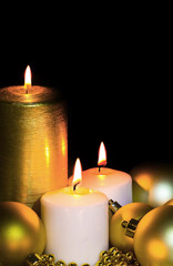 Golden Christmas Candle and spheres on the black