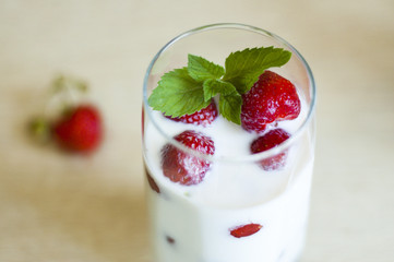 milk with strawberries in a glass