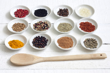 Spices and dried vegetables on vintage white planks