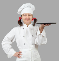 Female chef with a tray.