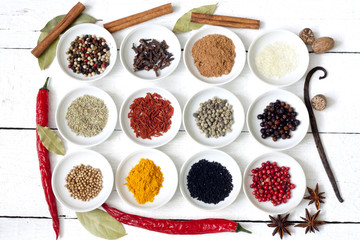 Spices and dried vegetables on vintage white planks