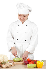 Woman chef chops vegetables for cooking
