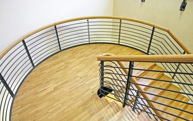 wood spiral staircase with very wide curve