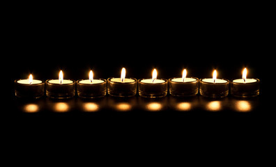 line candles on a black background