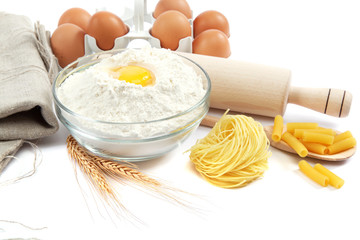 Bakery ingredient. Flour with raw eggs for making dough isolated