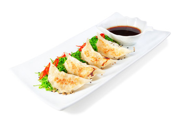 Dumplings, ravioli filled with seafood. With black vinegar.