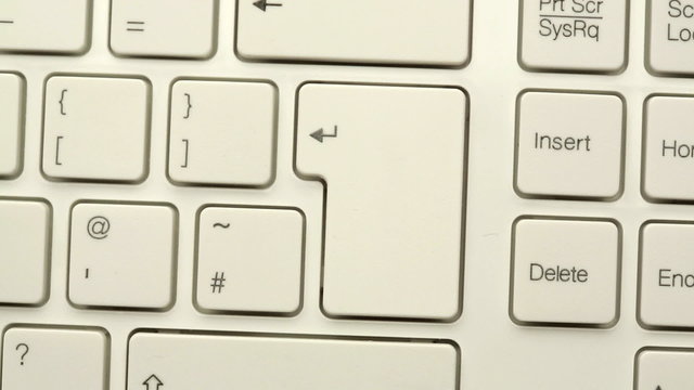 Hand pressing enter key