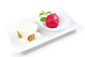 Delicious ice cream with cream in a dish for dessert, with a bea