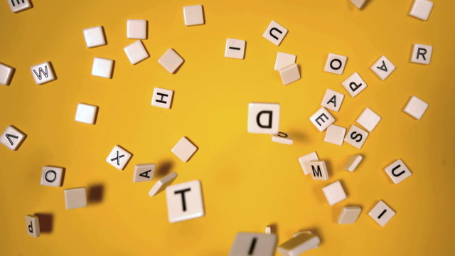 Plastic letters bouncing and spelling out autism