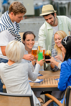 Group Of Cheerful People Toasting With Cocktails