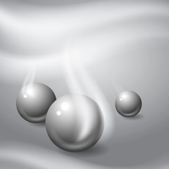 Metal balls on gray background.