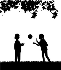 Kids playing with ball in park in spring silhouette