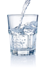 Water pouring into glasses isolated on a white background