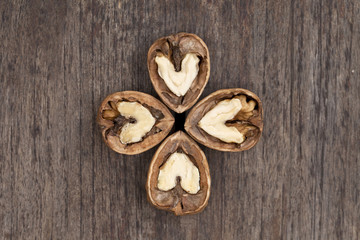 Four walnuts with a heart shaped interior.