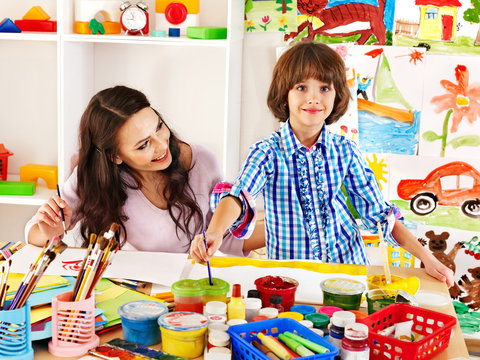 Family with child painting .