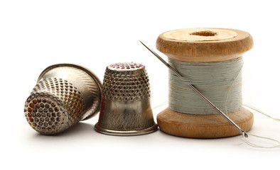 Sewing thimbles, bobbin and needle