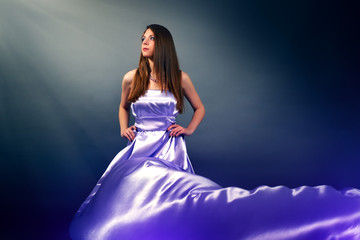 Beautiful girl in violet long dress