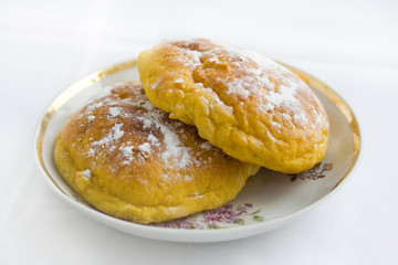 Sweet buns on the saucer