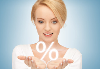 woman showing sign of percent in her hands