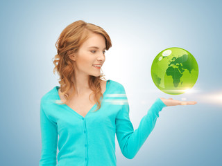 woman holding green globe on her hand