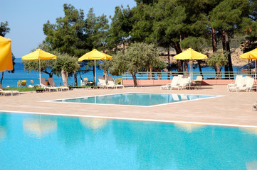 Swimming pool by a beach at the modern luxury hotel, Thassos isl