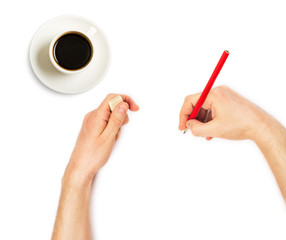 Human hands with pencil and erase rubber and cup of coffee