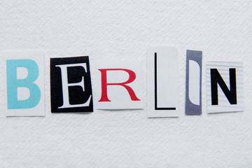 word berlin cut from newspaper on handmade paper