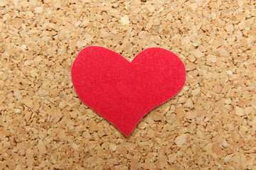 paper red heart on cork background
