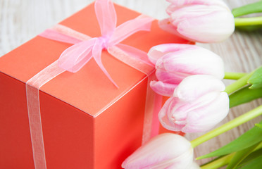 bouquet of  tulips, gift box on a table