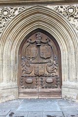 Brown wood old door in the cathedral in Bath, England