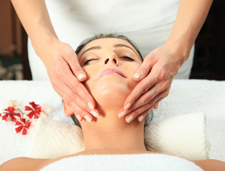 Fototapeta na wymiar Young woman receiving massage
