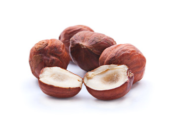 Split hazelnut on white