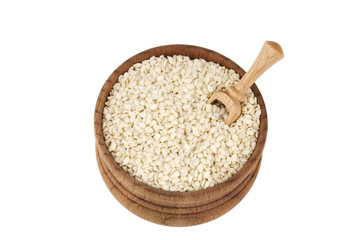 Sesame seeds in wooden bowl isolated on white