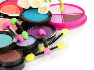 Bright eye shadows and sponge brushes for foundation isolated