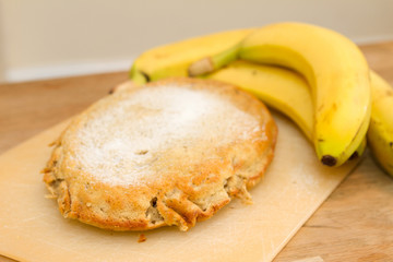 Freshly baked banana cake on wooden table top