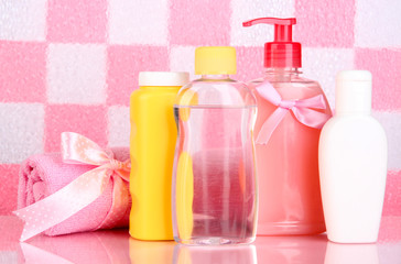 Baby cosmetics and towel in bathroom