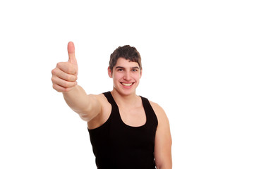 Young man with thumbs up. Man looking at the camera.