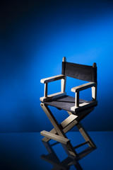 Director chair on a dramatic lit background