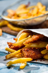 Homemade Fish & Chips served in the newspaper