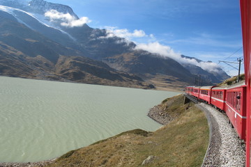 red train around the beautiful Swiss mountains 27
