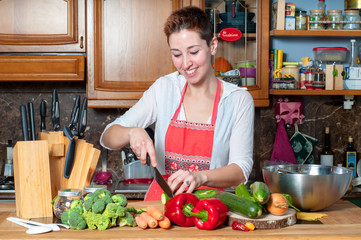 beautiful housewife cooking vegetables