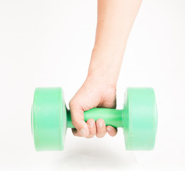 green dumbbell in hand isolated on white