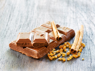 Broken сhocolate on wooden table