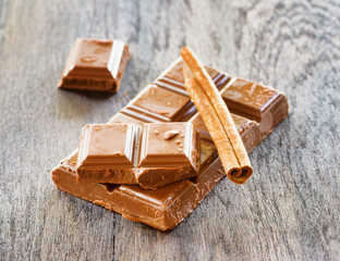 Broken сhocolate on wooden table