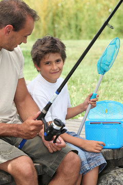 Father and son fishing together