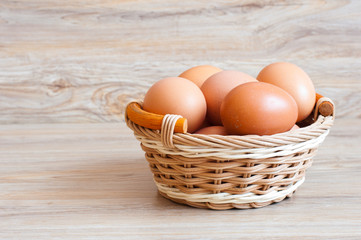 Brown eggs in a wicker basket