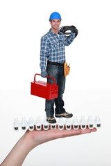 Electrician with cable and tool box