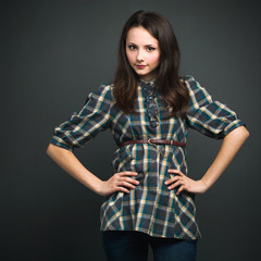 Lovely smiling girl on dark background