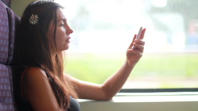 Young woman traveling by train