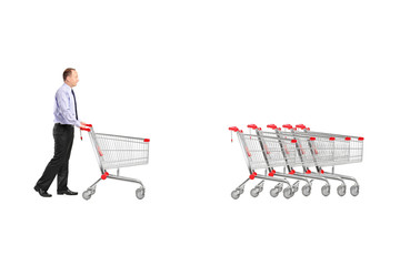Full length portrait of a man returning an empty shopping cart